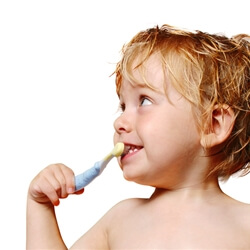 Little boy brushing his teeth